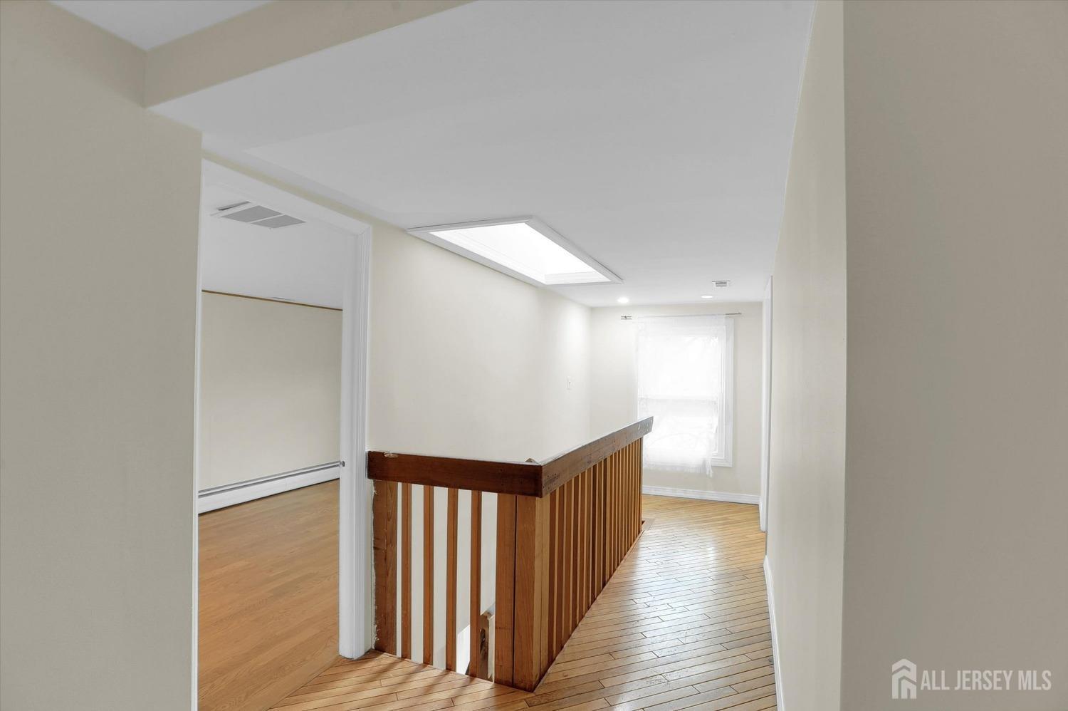 434 Ridge Road Dayton, NJ 08810 - Photo 26 of 46 a view of a hallway with wooden floor