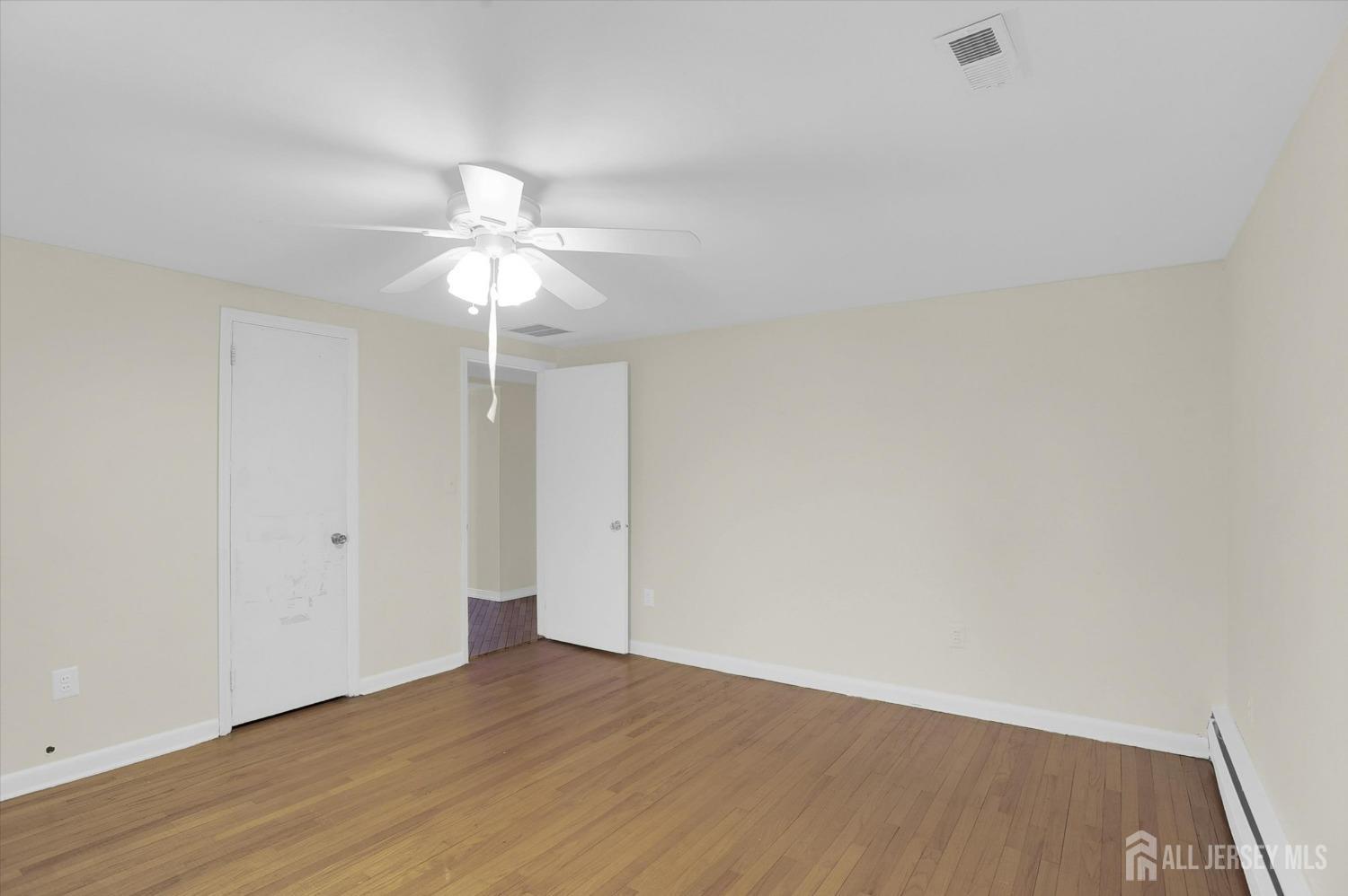 434 Ridge Road Dayton, NJ 08810 - Photo 30 of 46 wooden floor in an empty room