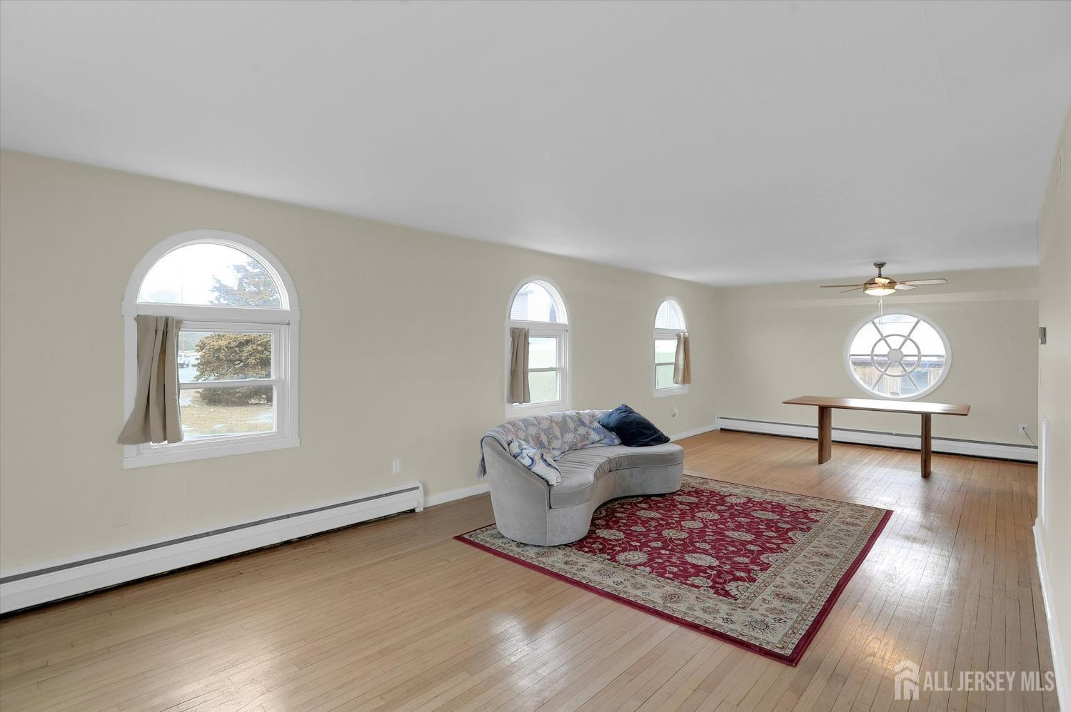 434 Ridge Road Dayton, NJ 08810 - Photo 3 of 46 a living room with furniture and a window
