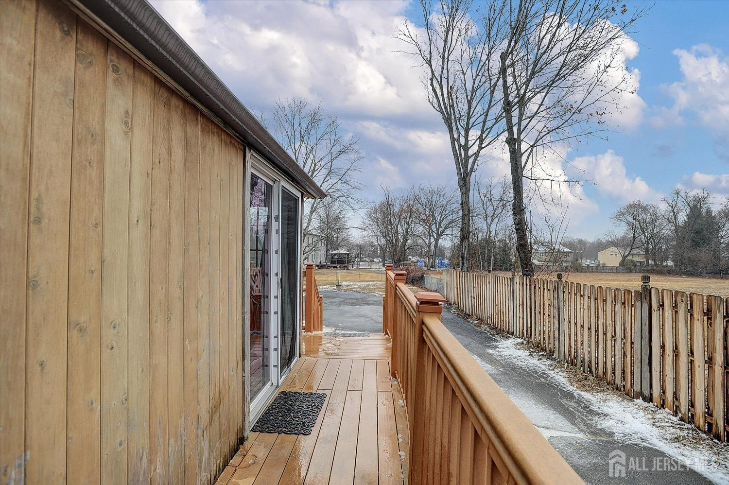 434 Ridge Road Dayton, NJ 08810 - Photo 38 of 46 a view of balcony with wooden floor and fence