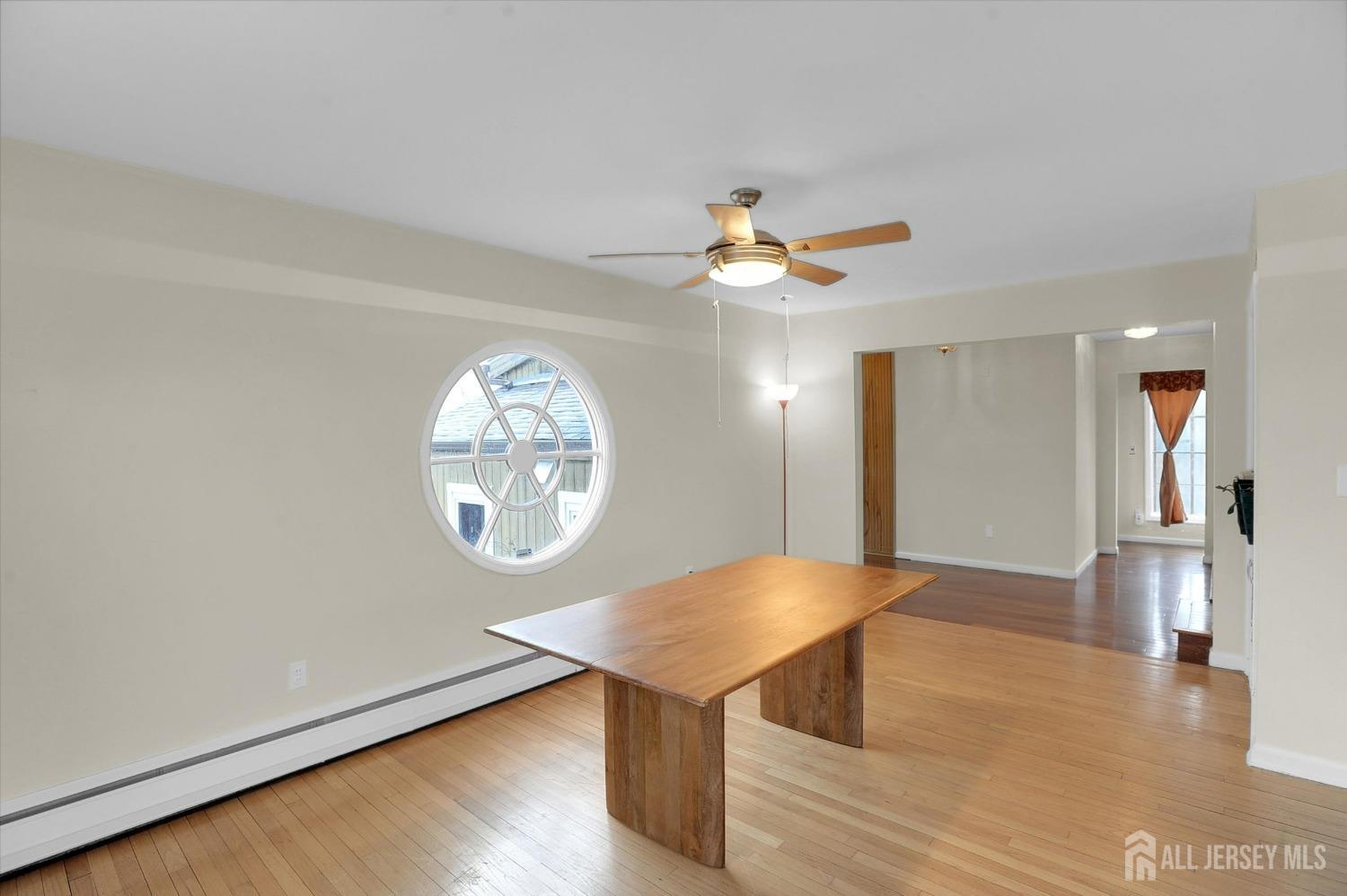 434 Ridge Road Dayton, NJ 08810 - Photo 7 of 46 a view of a livingroom with a table and chair