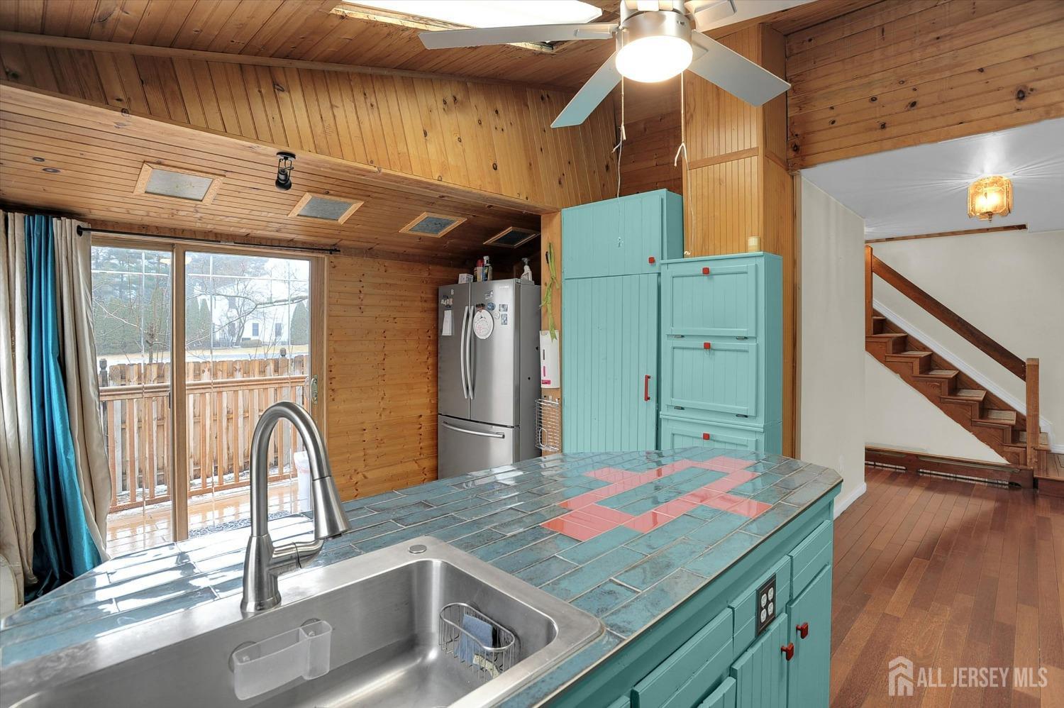 434 Ridge Road Dayton, NJ 08810 - Photo 10 of 46 a kitchen with a refrigerator and countertop