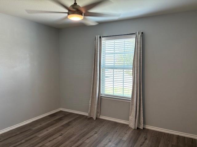 515 Rustic Meadows Trail Princeton, TX 75407 - Photo 9 of 29 an empty room with wooden floor and windows