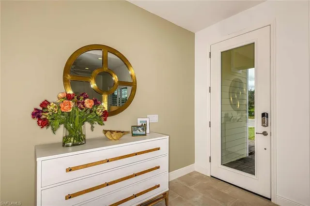 a bathroom with a sink mirror and vanity