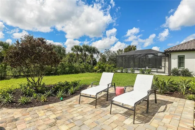 a view of a chairs and table in the patio