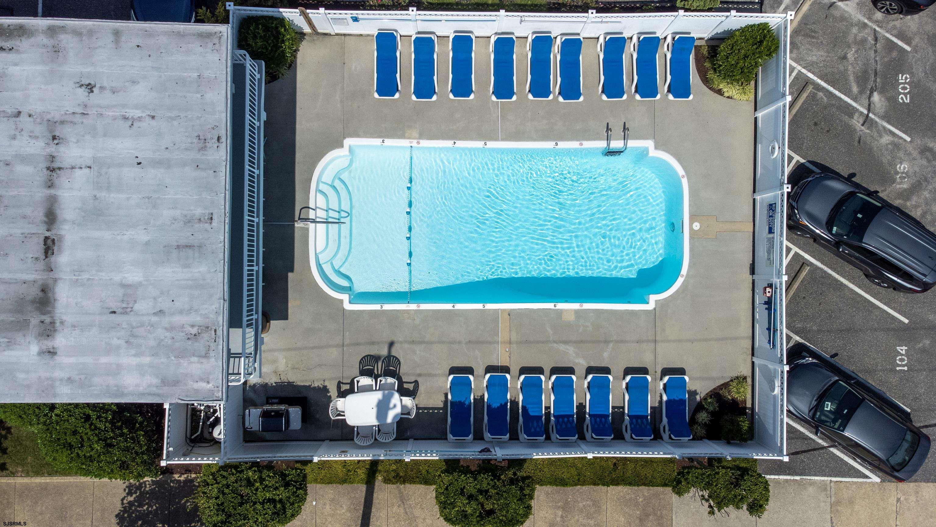 900 Wesley Avenue, Unit 210 Ocean City, NJ 08226 - Photo 16 of 16 a view of swimming pool with a fireplace and a couch
