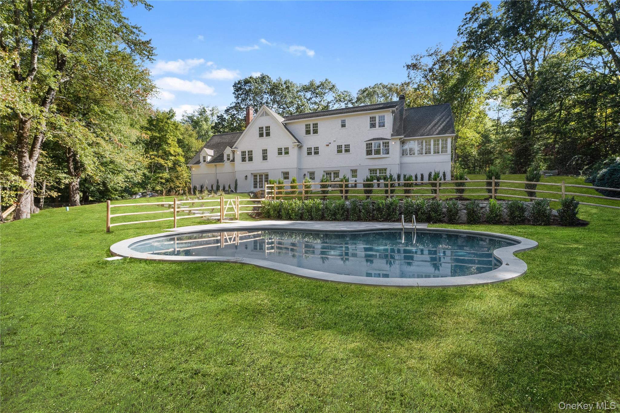 View of pool with view of scattered trees