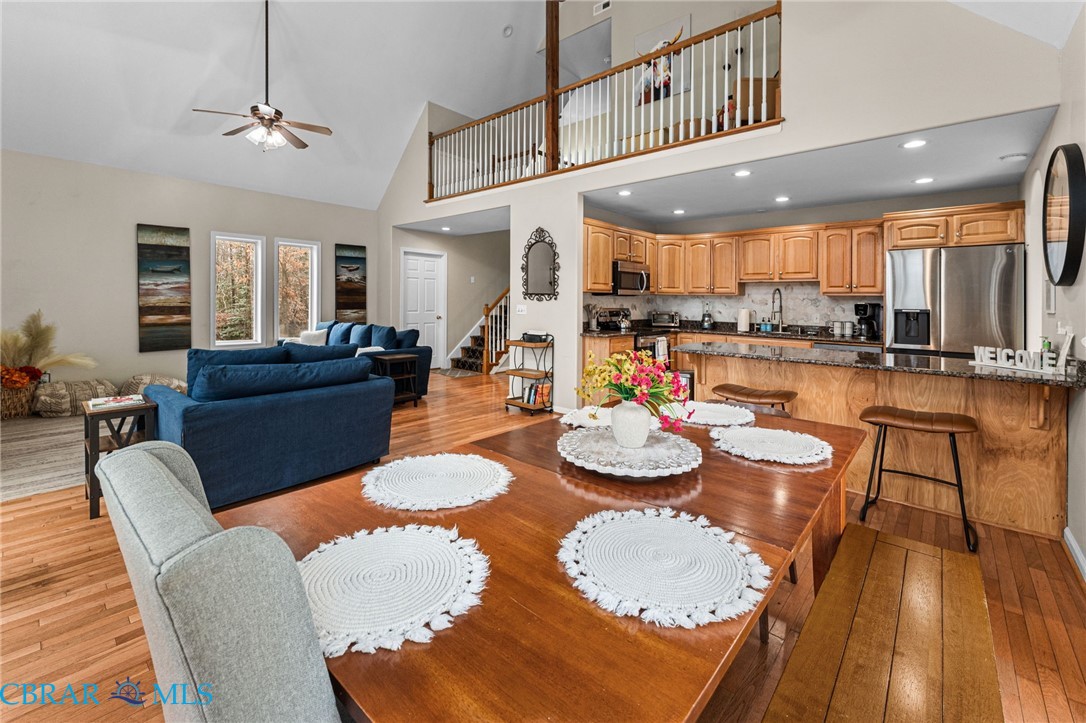 4775 Stormont Road Hartfield, VA 23071 - Photo 23 of 45 Dining area featuring ceiling fan, lofted ceiling, light wood finished floors, and recessed lighting