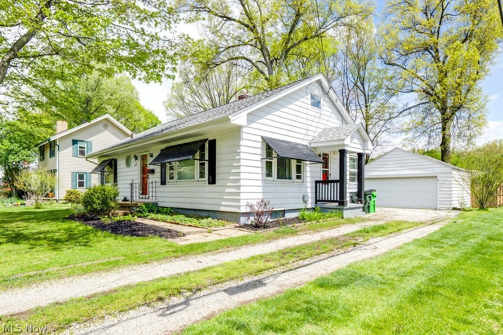 3569 Elm Road Stow, OH 44224 - Photo 2 of 17 White siding exterior featuring black window awnings and shutters
