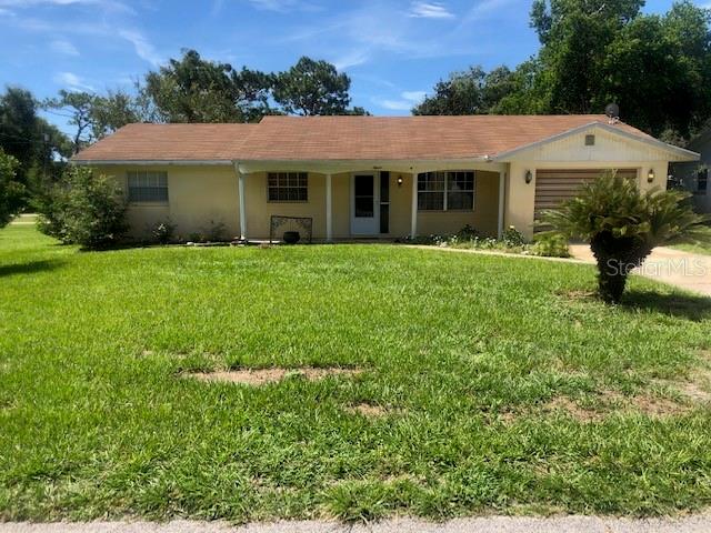 15 Valencia Road DeBary, FL 32713 - Photo 1 of 1 front view of a house with a garden