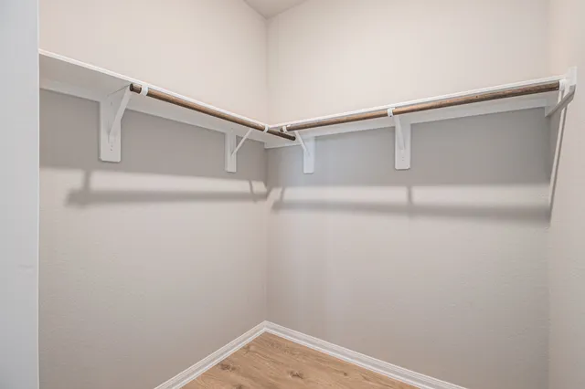 a view of an empty walk in closet