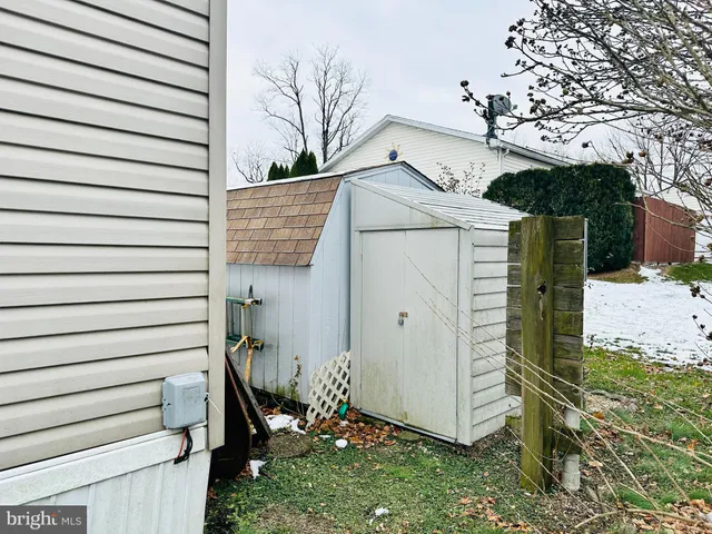 a view of a house with a tree