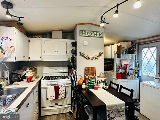 a kitchen with a refrigerator and stove