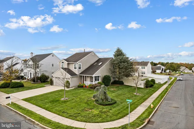 a view of a house with a backyard porch and sitting area