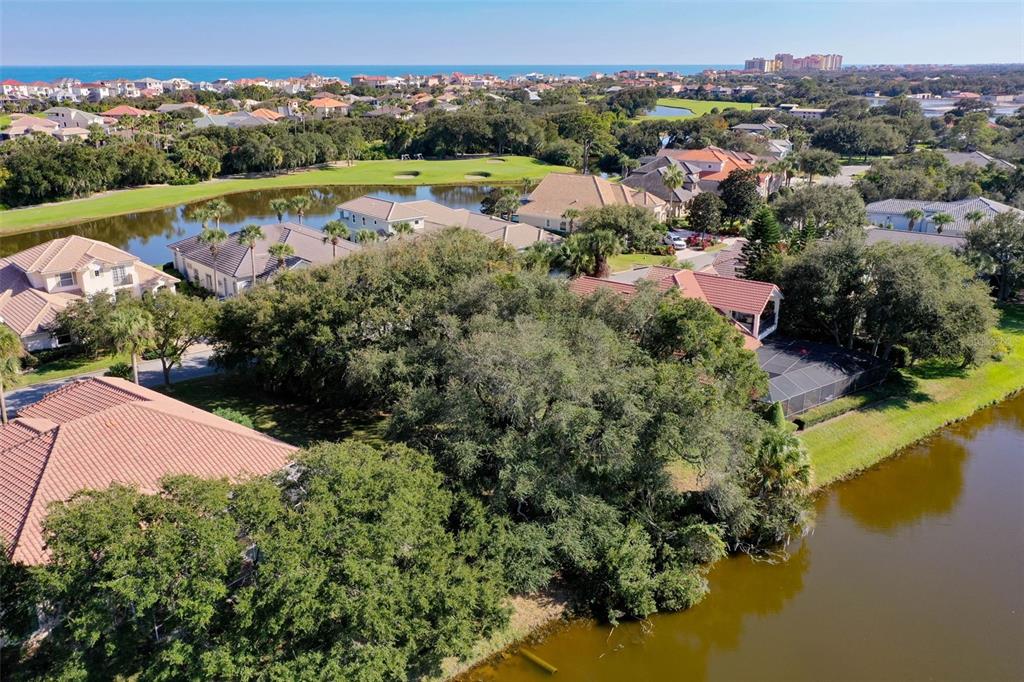 8 Flagship Drive Palm Coast, FL 32137 - Photo 15 of 31 an aerial view of a houses with a lake view
