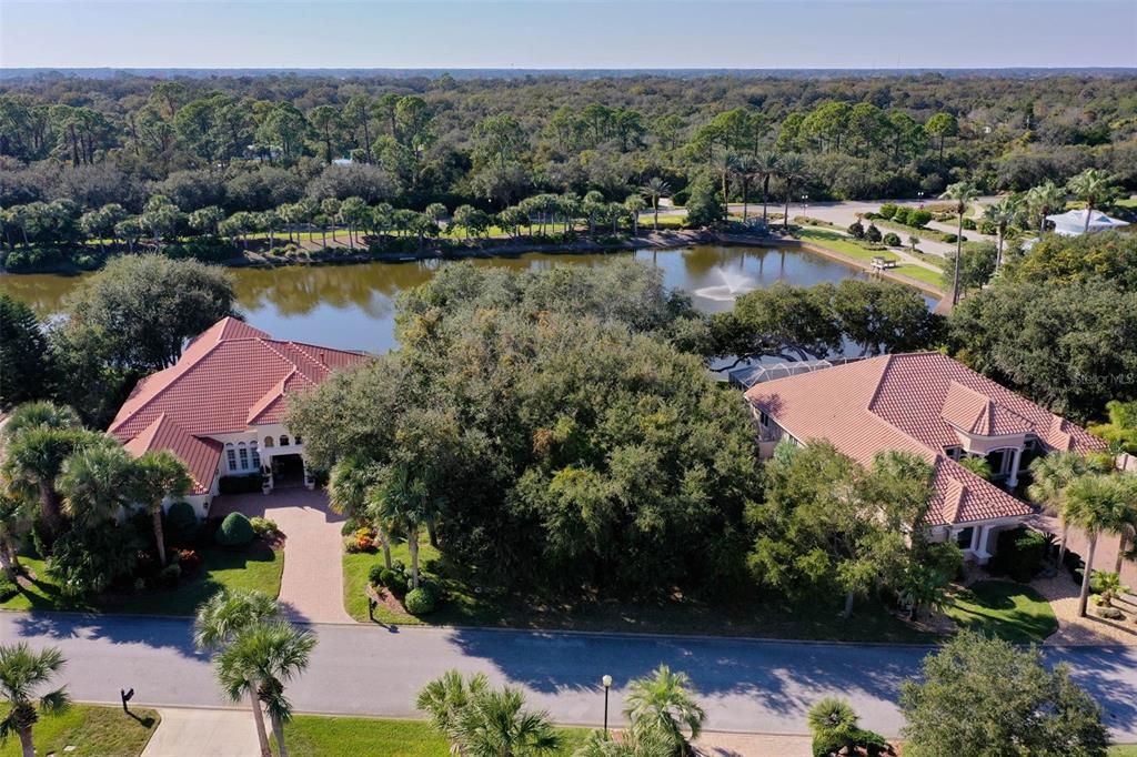 8 Flagship Drive Palm Coast, FL 32137 - Photo 18 of 31 an aerial view of lake residential house with swimming pool and mountains