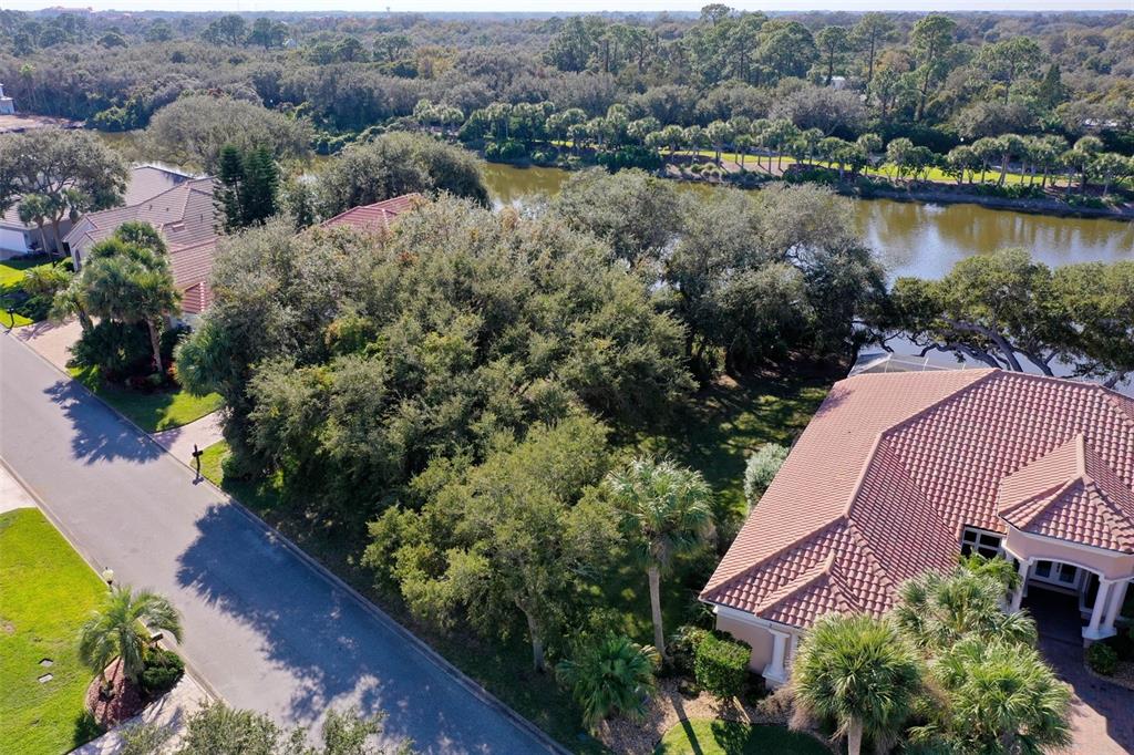 8 Flagship Drive Palm Coast, FL 32137 - Photo 19 of 31 an aerial view of house with outdoor space and lake view