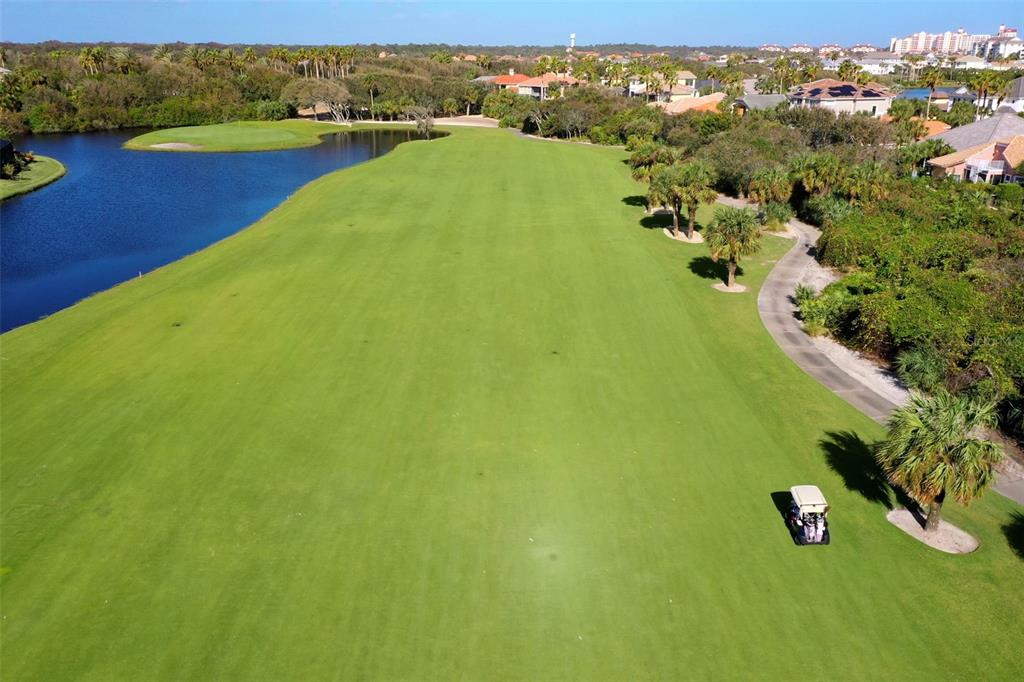 8 Flagship Drive Palm Coast, FL 32137 - Photo 25 of 31 a view of a lake with houses