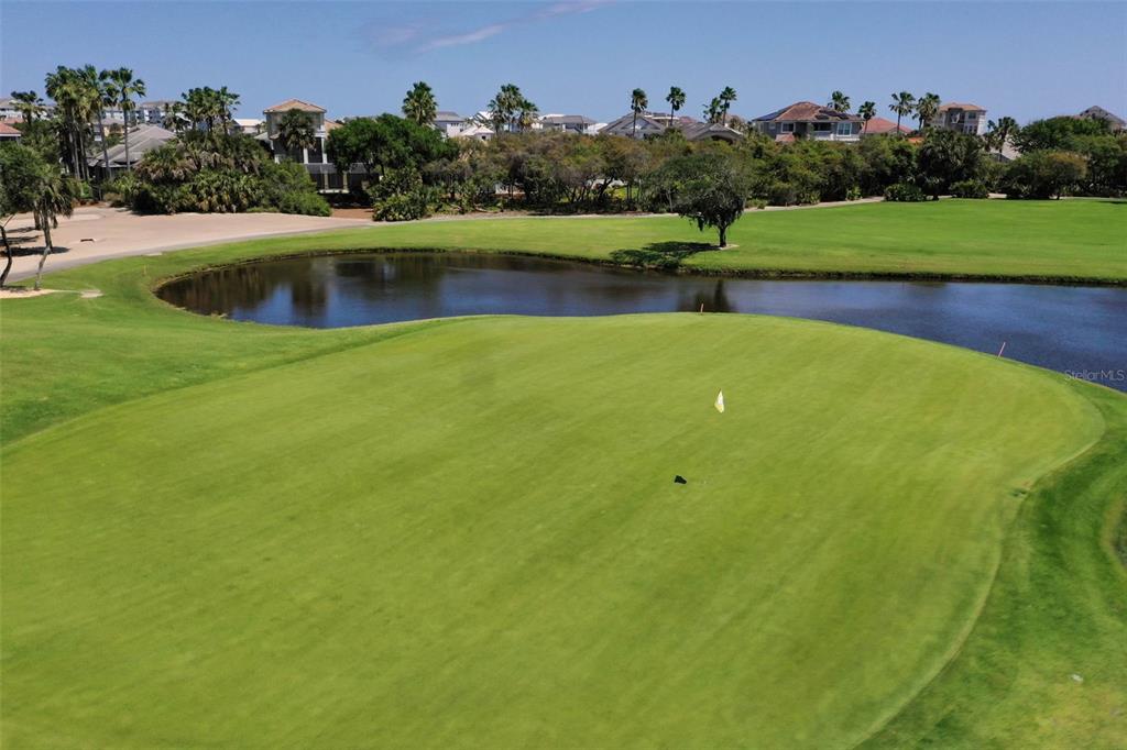 8 Flagship Drive Palm Coast, FL 32137 - Photo 27 of 31 a view of a swimming pool and a yard