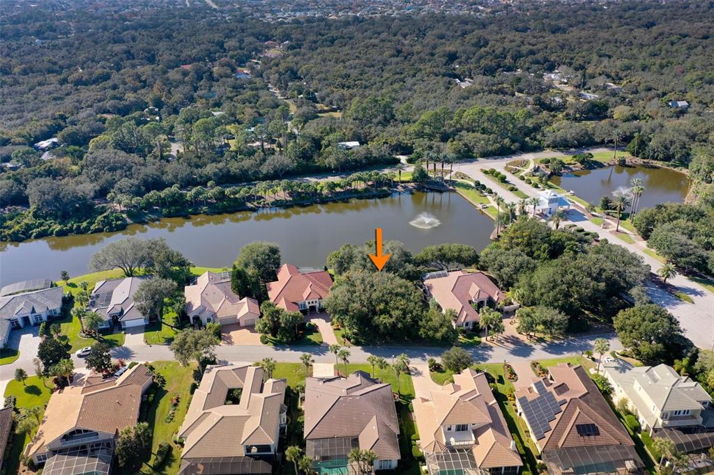 8 Flagship Drive Palm Coast, FL 32137 - Photo 6 of 31 an aerial view of lake residential house with swimming pool and outdoor space
