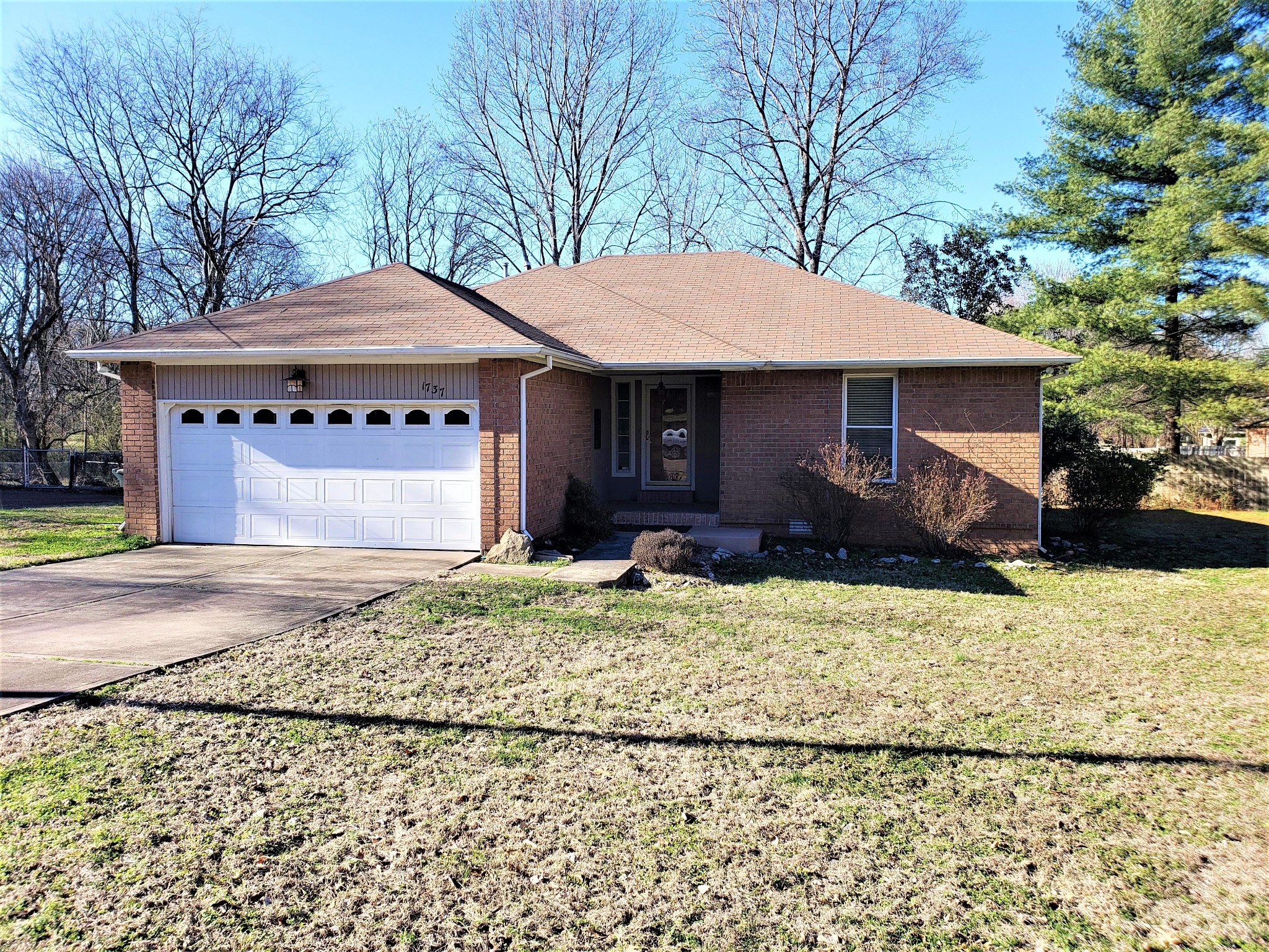 1737 Ridgemere Court Hermitage, TN 37076 - Photo 1 of 14 a backyard of a house with large trees