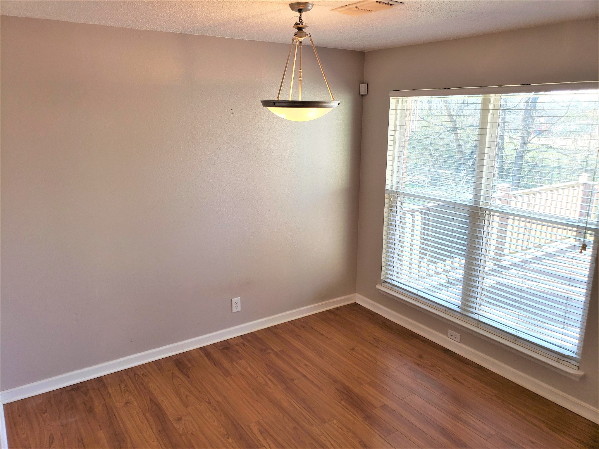 1737 Ridgemere Court Hermitage, TN 37076 - Photo 4 of 14 a view of an empty room with wooden floor and a window