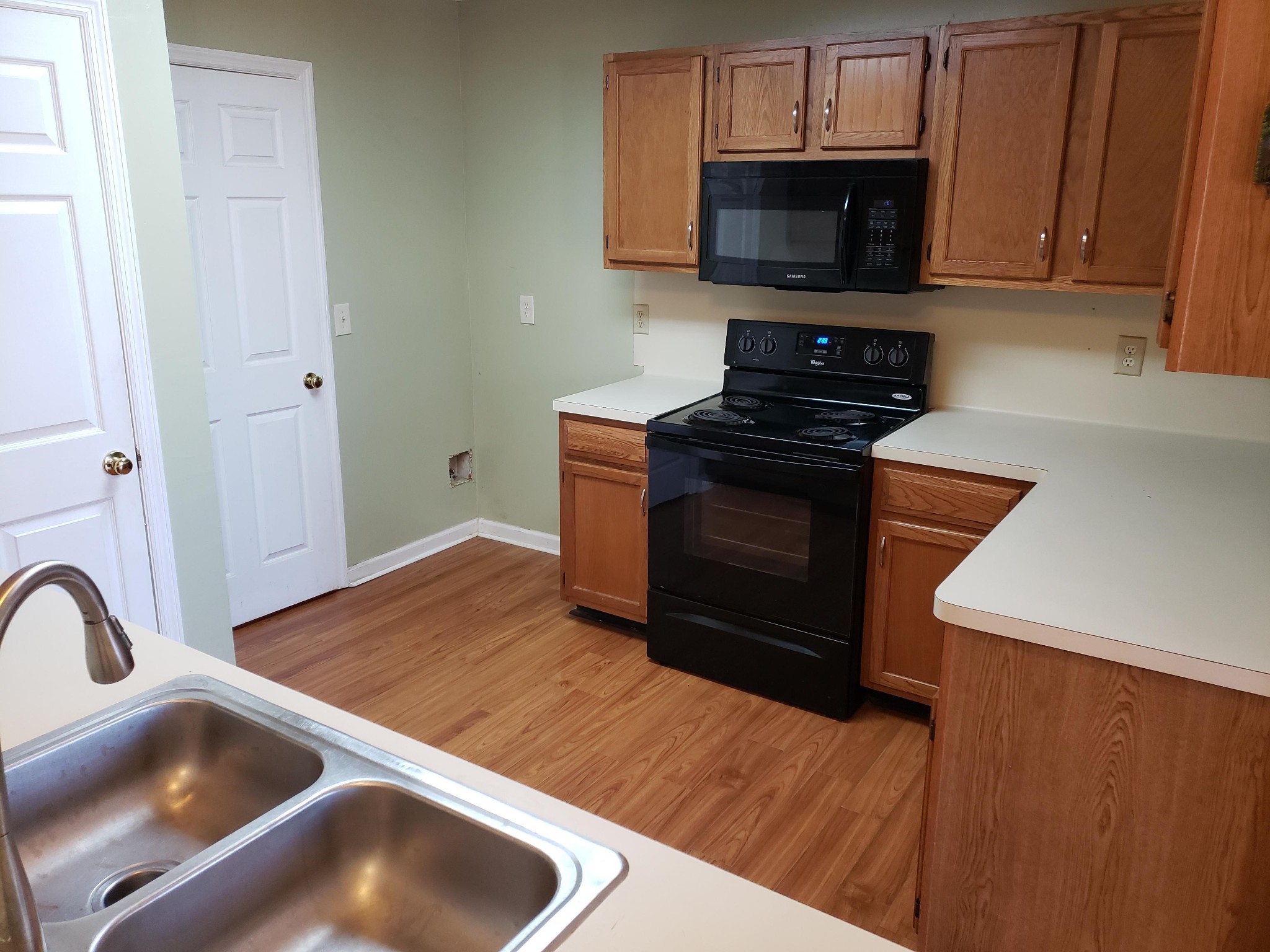 1737 Ridgemere Court Hermitage, TN 37076 - Photo 5 of 14 a kitchen with granite countertop a stove and a sink