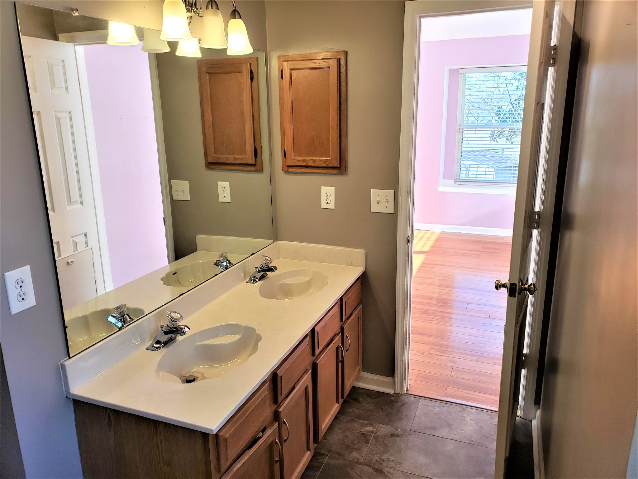 1737 Ridgemere Court Hermitage, TN 37076 - Photo 8 of 14 a bathroom with a sink a mirror and a shower