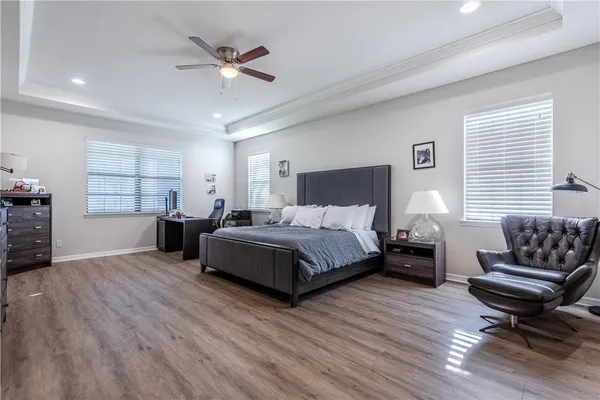 a spacious bedroom with a bed and window