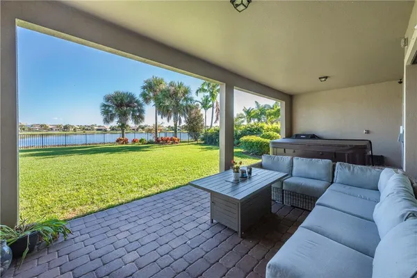 a living room with furniture and a garden