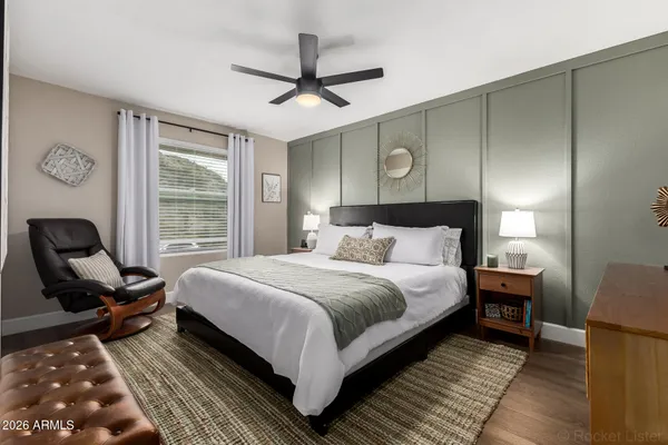 a bedroom with bed and window