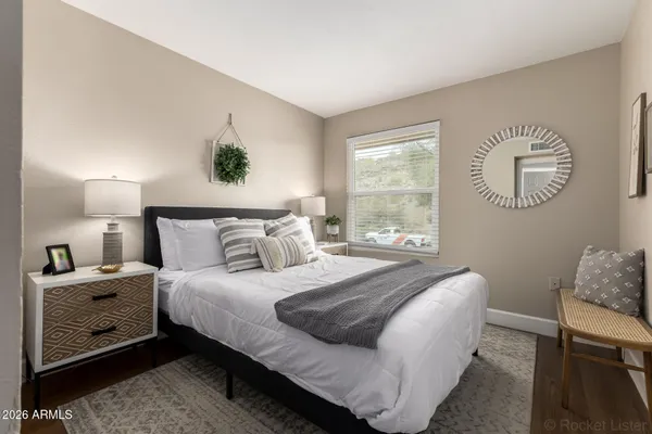 a bedroom with a bed and window