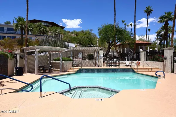 a view of a swimming pool with a patio