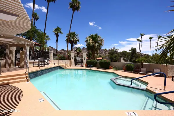 a view of a swimming pool with a lounge chair
