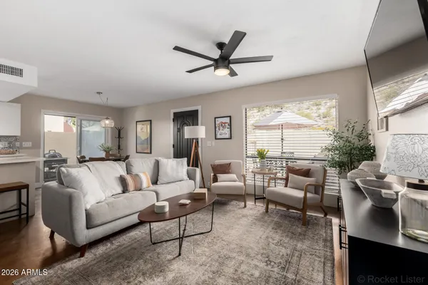 a living room with furniture and a large window