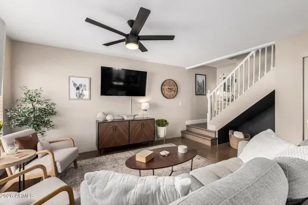 a living room with furniture and a flat screen tv