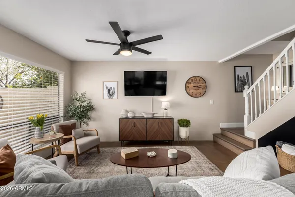 a living room with furniture and a flat screen tv
