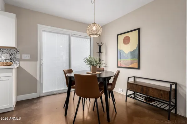 a dining room with furniture and window