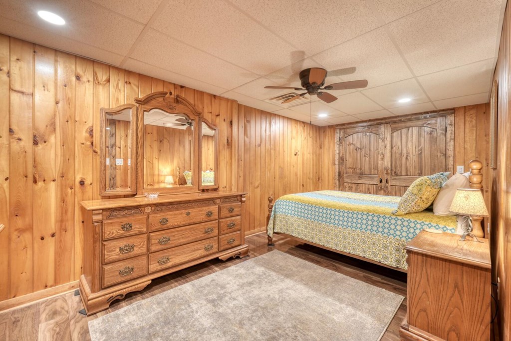 450 Mull Valley Road Morganton, GA 30560 - Photo 18 of 36 a spacious bedroom with a bed and a chandelier