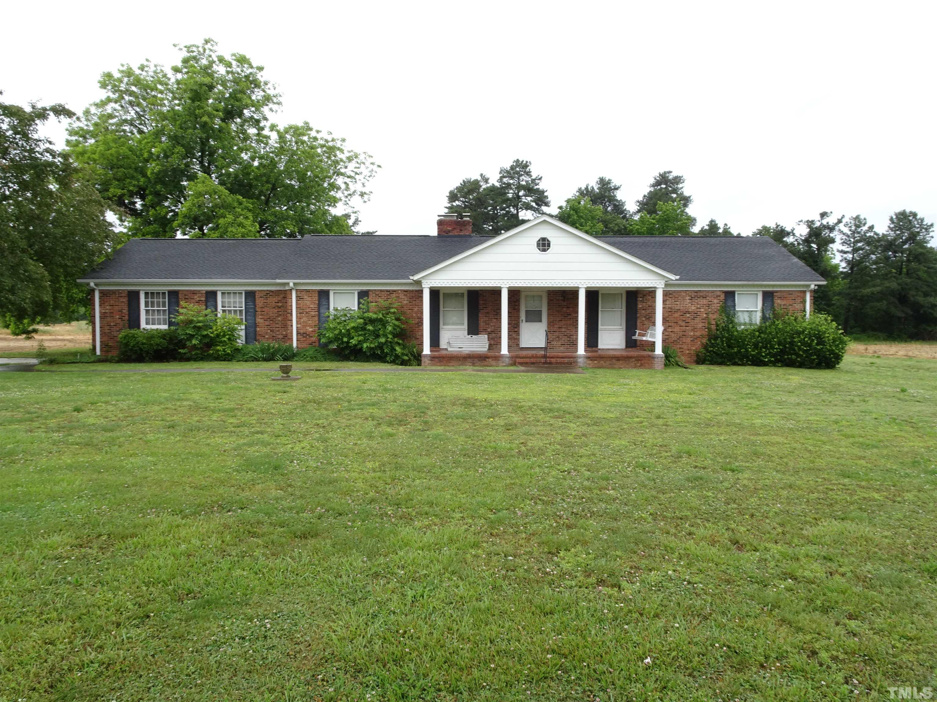 Spacious covered front porch with tile flooring with welcome to this home.