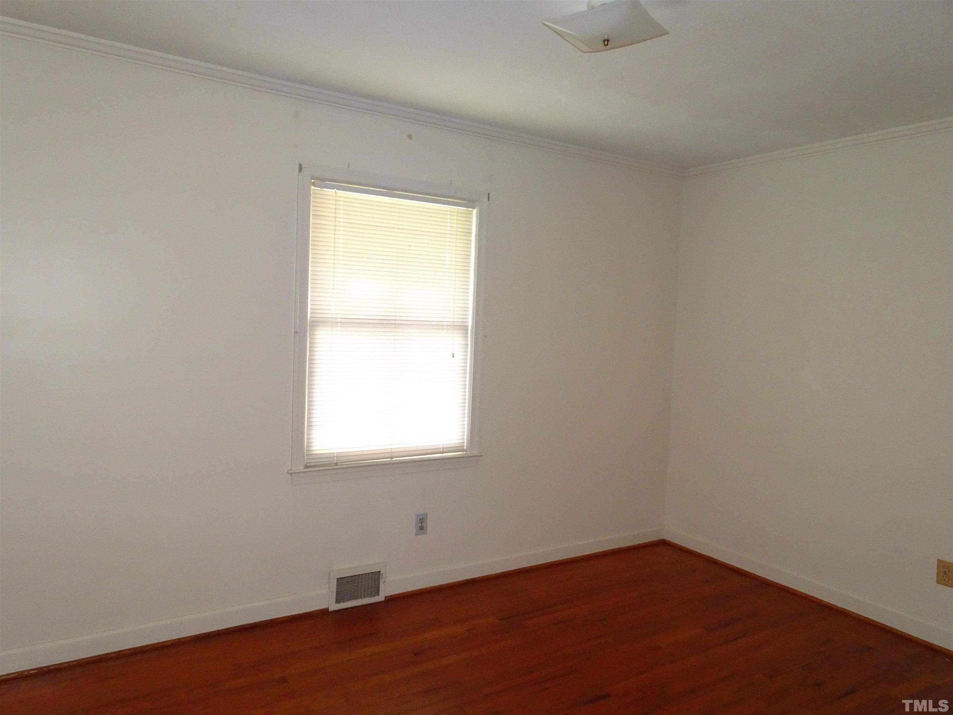 1619 Warrenton Road Henderson, NC 27537 - Photo 15 of 51 First bedroom on right of the hall with hard wood floor.