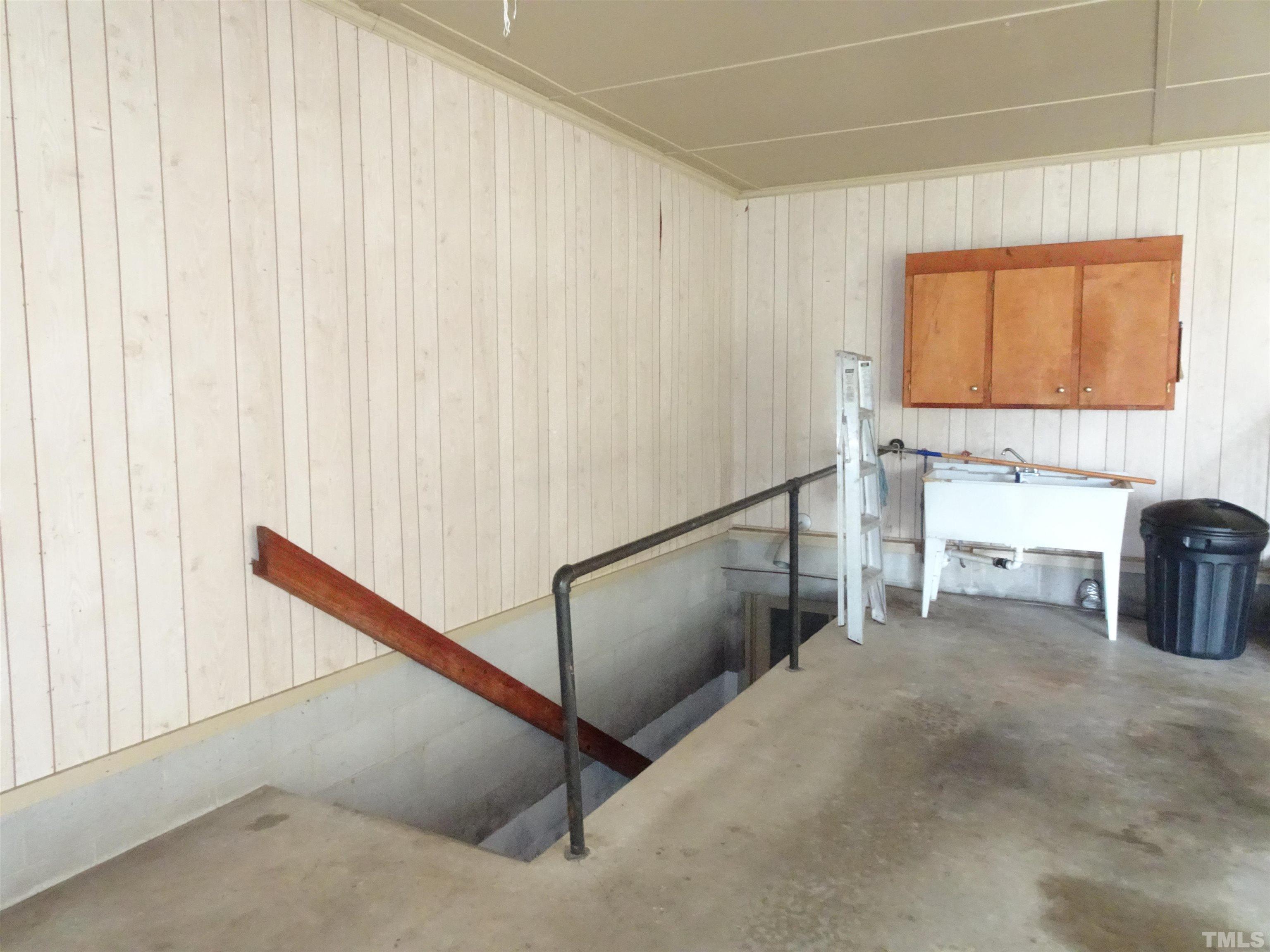 1619 Warrenton Road Henderson, NC 27537 - Photo 30 of 51 Steps to the basement are in the garage