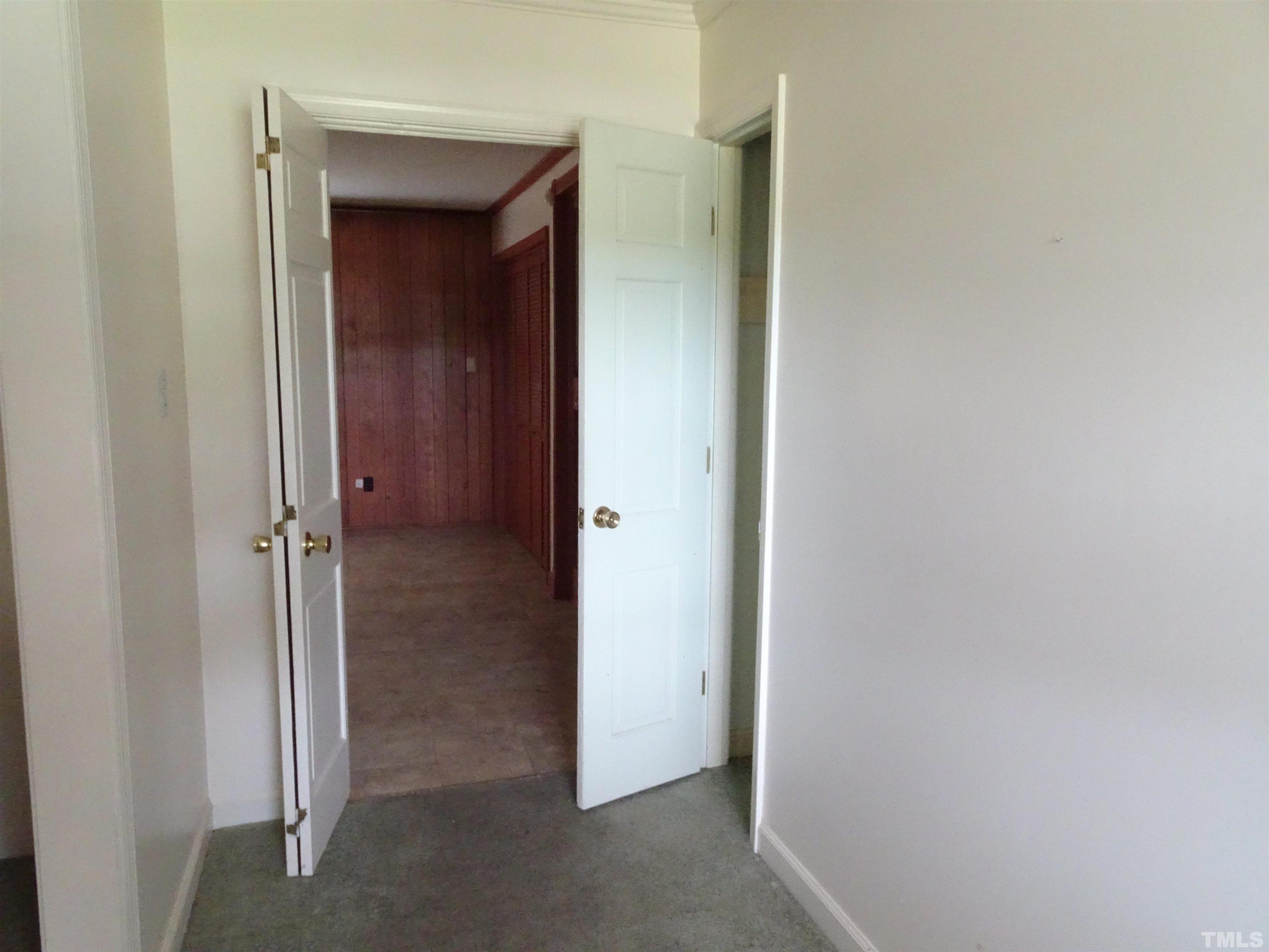 1619 Warrenton Road Henderson, NC 27537 - Photo 3 of 51 From the front porch is the foyer with access to coat closet and the living room.