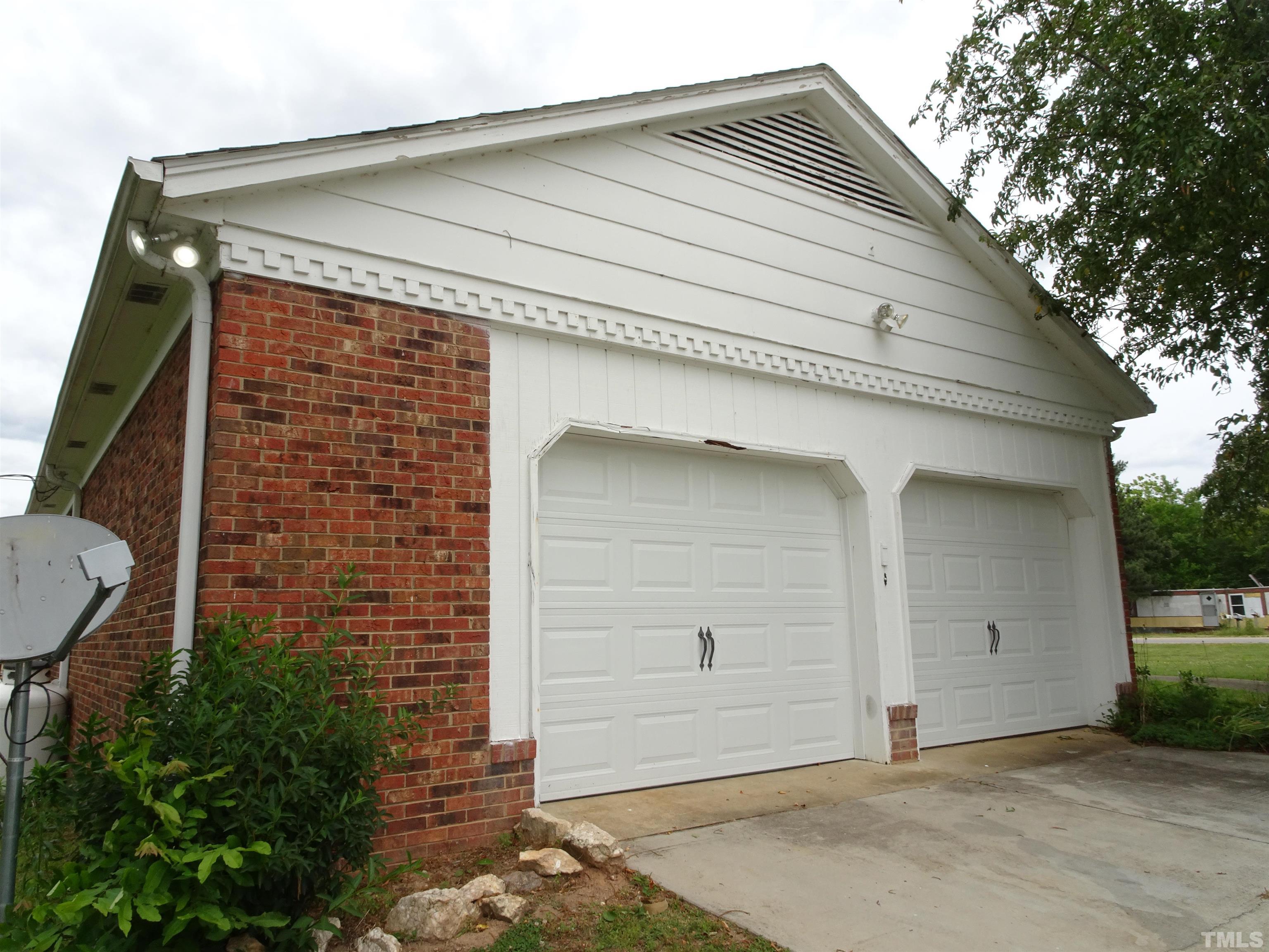 1619 Warrenton Road Henderson, NC 27537 - Photo 41 of 51 Photo of the side of the drive with the garage doors