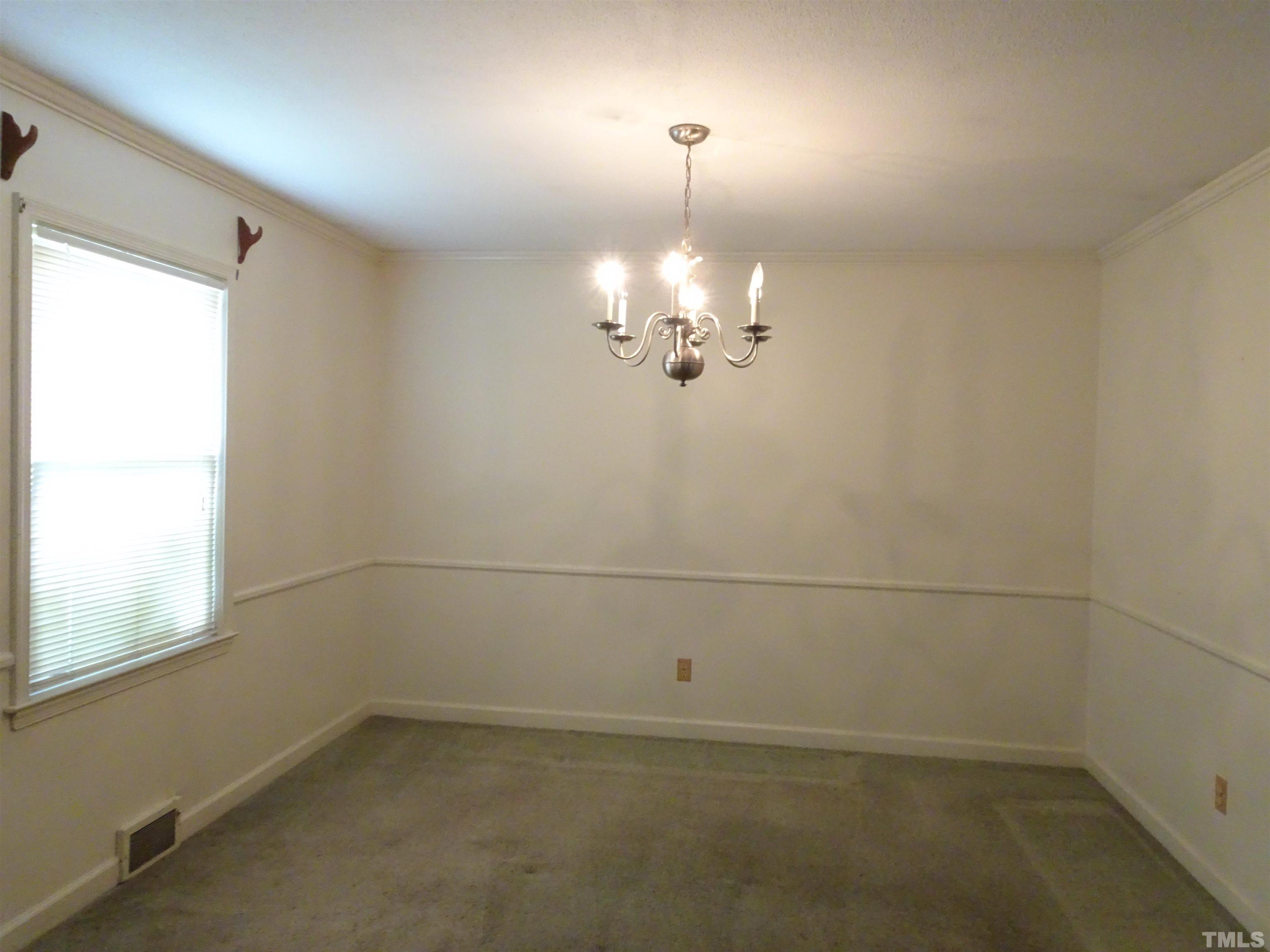1619 Warrenton Road Henderson, NC 27537 - Photo 5 of 51 The Dining room on the front of the home with access to the kitchen and the living room