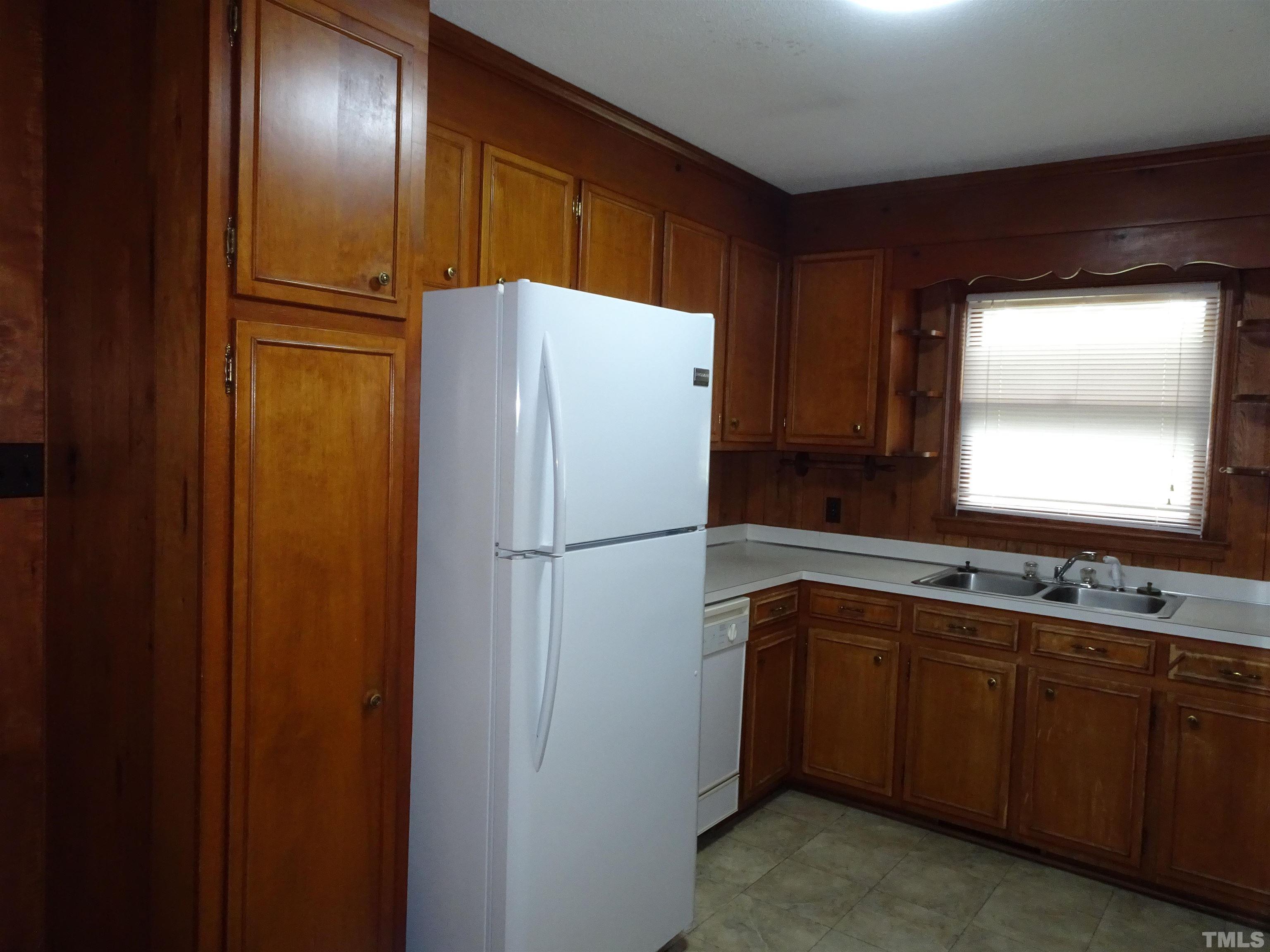 1619 Warrenton Road Henderson, NC 27537 - Photo 6 of 51 The kitchen is equipped with refrigerator, cooking surface and oven.