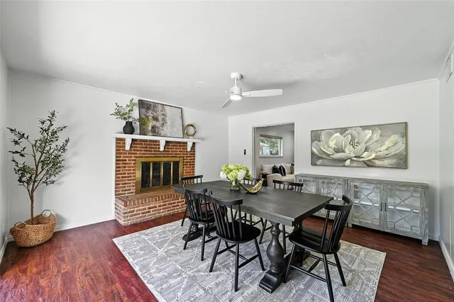 a dining room with furniture and wooden floor