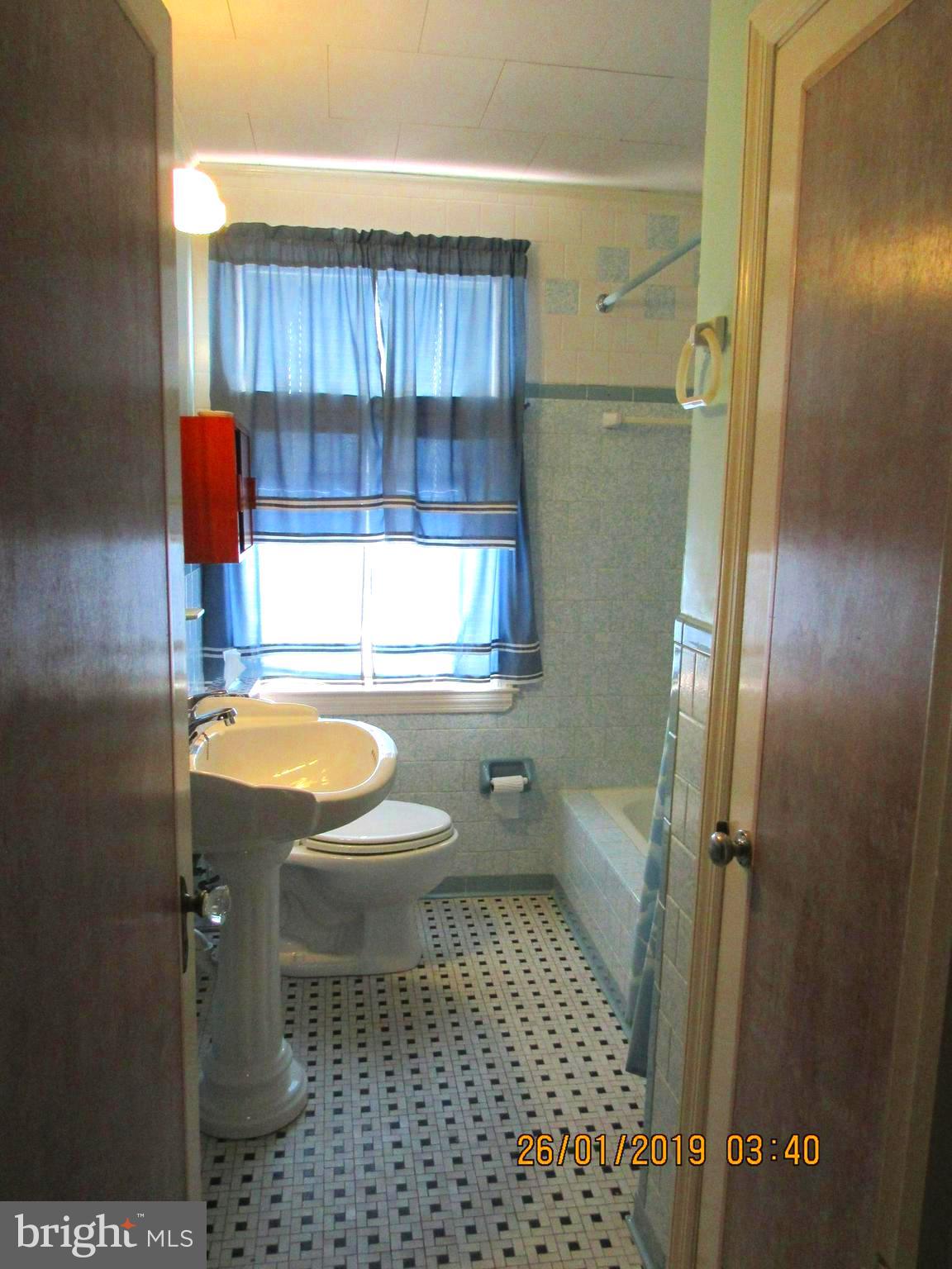 1524 Tunlaw Road Baltimore, MD 21218 - Photo 13 of 34 Pedestal sink in upstairs bathroom