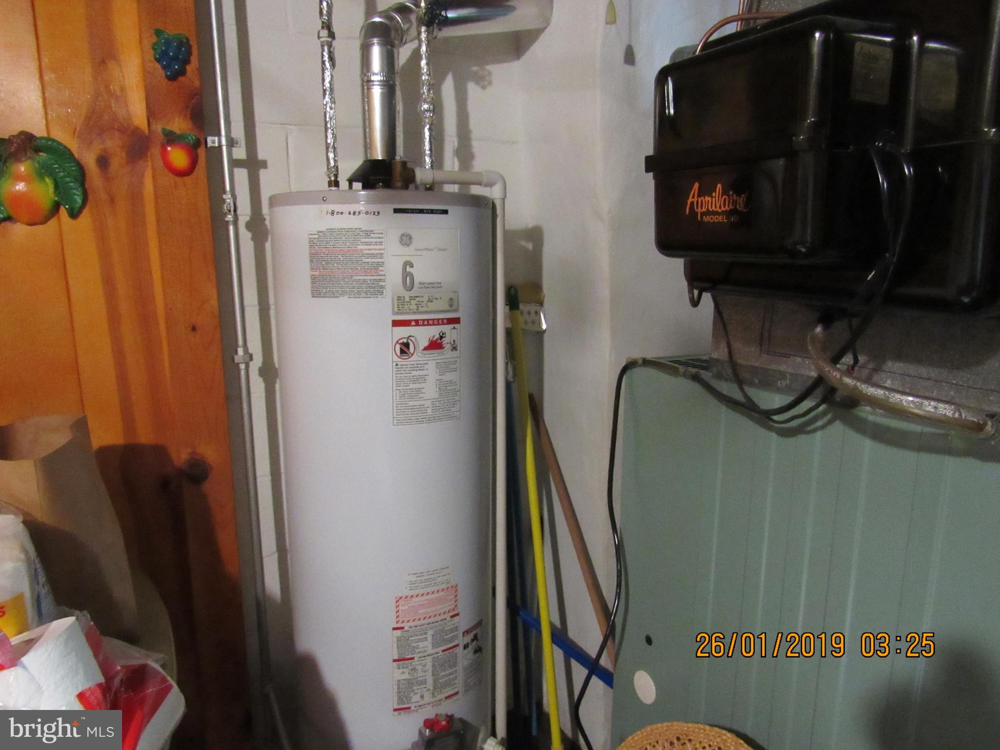 1524 Tunlaw Road Baltimore, MD 21218 - Photo 28 of 34 Furnace and hot Water heater