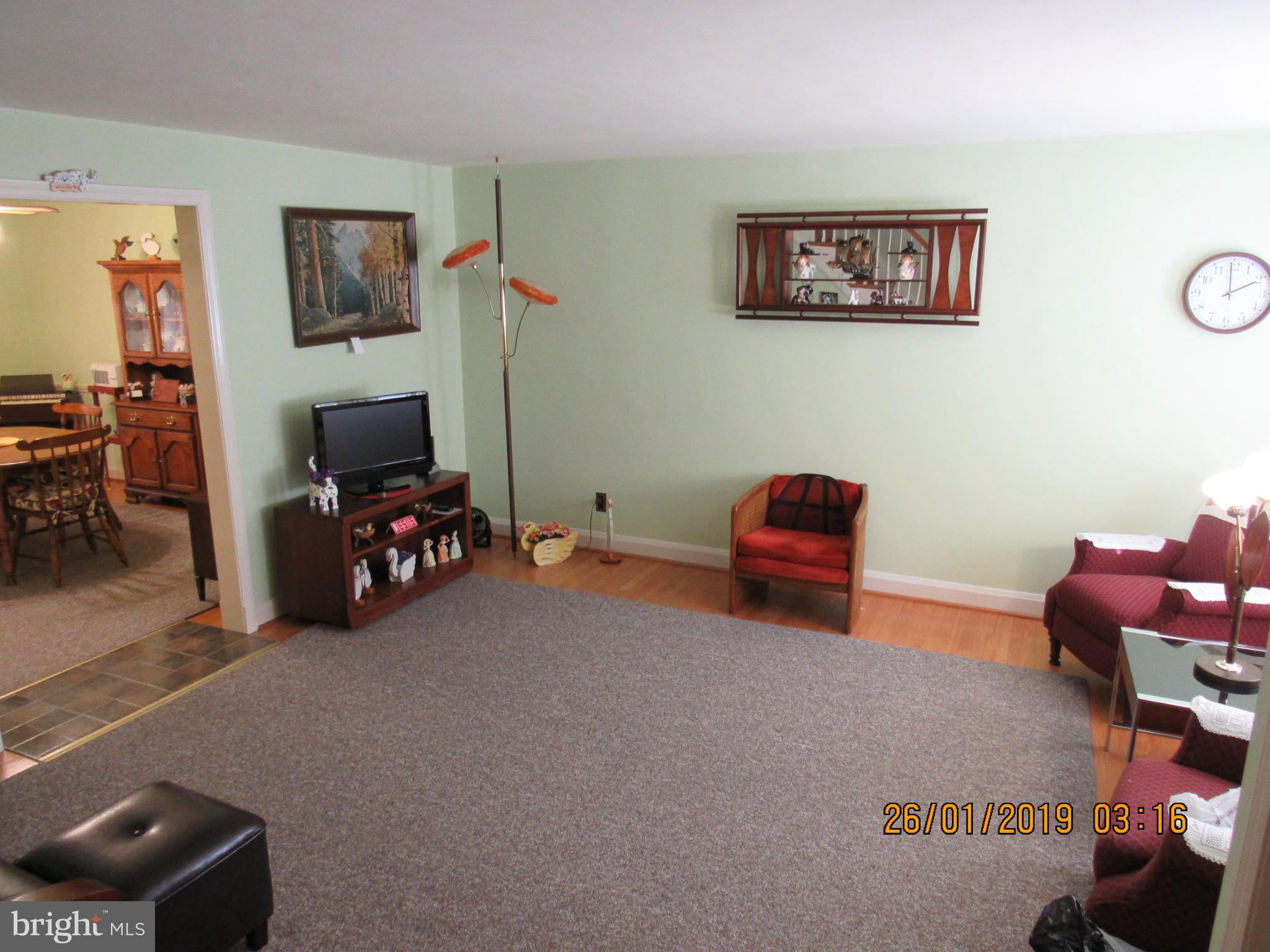 1524 Tunlaw Road Baltimore, MD 21218 - Photo 4 of 34 living room flows into dining room